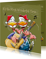 Grappige kerstkaart met twee vogels die gitaar spelen
