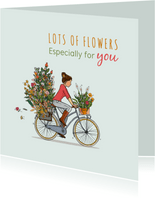 Verjaardagskaart op de fiets met veel bloemen