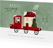 Kerst-verhuiskaartje verhuisbusje met huis en kerstboom