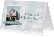Kerst verhuiskaart met kerstlampjes achtergrond
