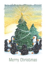 Kerstkaart met pinguïns om de kerstboom