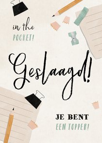 Geslaagd kaart met schriftje, potlood en puntenslijper