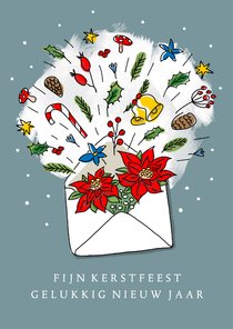 Kerstgroet in een envelop door de brievenbus 