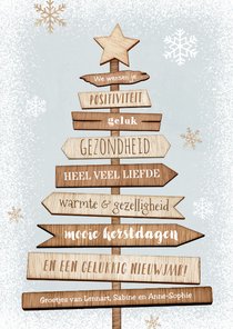 Kerstkaart kerstboom hout wegwijzers ster sneeuw winter