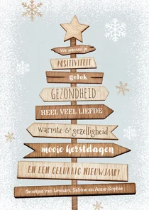 Kerstkaart kerstboom hout wegwijzers ster sneeuw winter