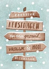 Kerstkaart wegwijzers hout winter sneeuw
