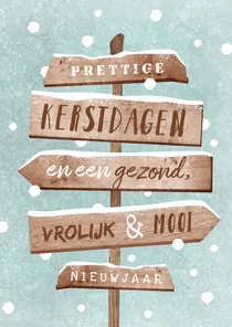 Kerstkaart wegwijzers hout winter sneeuw