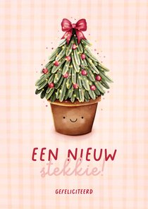 Vrolijke felicitatiekaartje verhuisd met kerstboom 