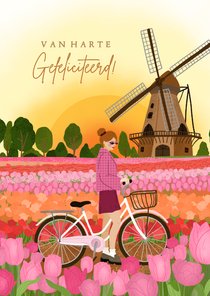 Vrolijke verjaardagskaart met meisje in tulpenveld