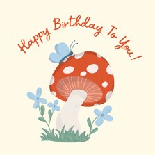 Lieve verjaardagskaart met paddestoel vlinders en bloemen