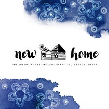 Verhuiskaart met een huisje en blauwe kleurvlekken