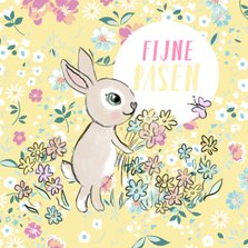 Vrolijke bloemen paaskaart met getekend konijntje