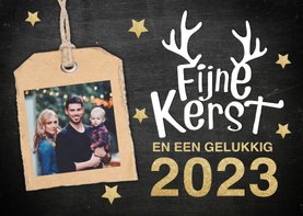 Kerstkaart met gouden letters en hip gewei en label