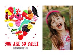 Valentijnskaart met snoepjes en een foto