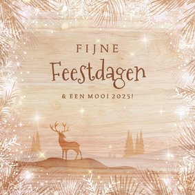 Houtlook kerstkaart met rendier in landschap en sneeuwborder