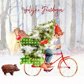 Kerstkaart met de kerstboom op de fiets