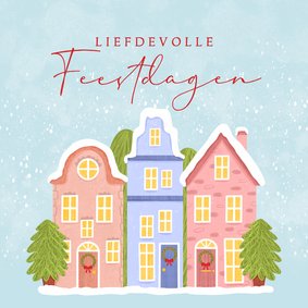 Kerstkaart met huisjes in de sneeuw en kerstbomen