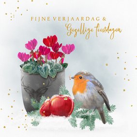 Kerstkaart roodborstje met pot cyclamen in de sneeuw