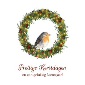 Klassieke kerstkaart met roodborstje in kerstkrans