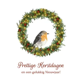 Klassieke kerstkaart met roodborstje in kerstkrans