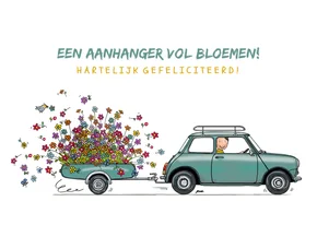Kleine auto met aanhangwagen en bloemen