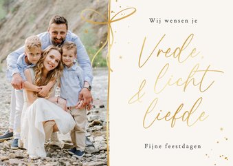 Kerstkaart christelijk licht liefde vrede strik goud foto