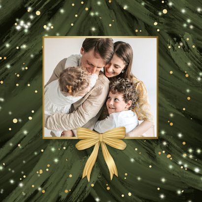 Kerstkaart kerstboom close up sprankelend foto's strik 2