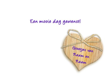 Kleurrijke bloemenpracht in border met houten hartje 3