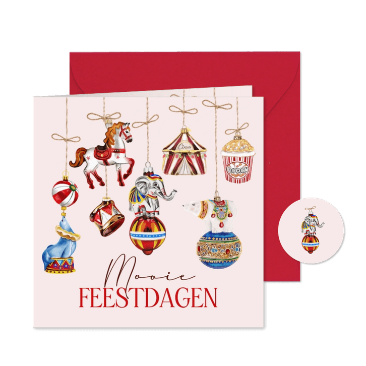 Kerstkaart circusornamenten aan touwtjes