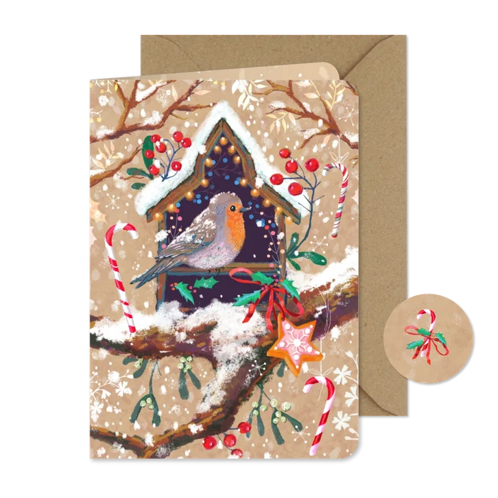 Lief kerstkaartje met een roodborst in huisje