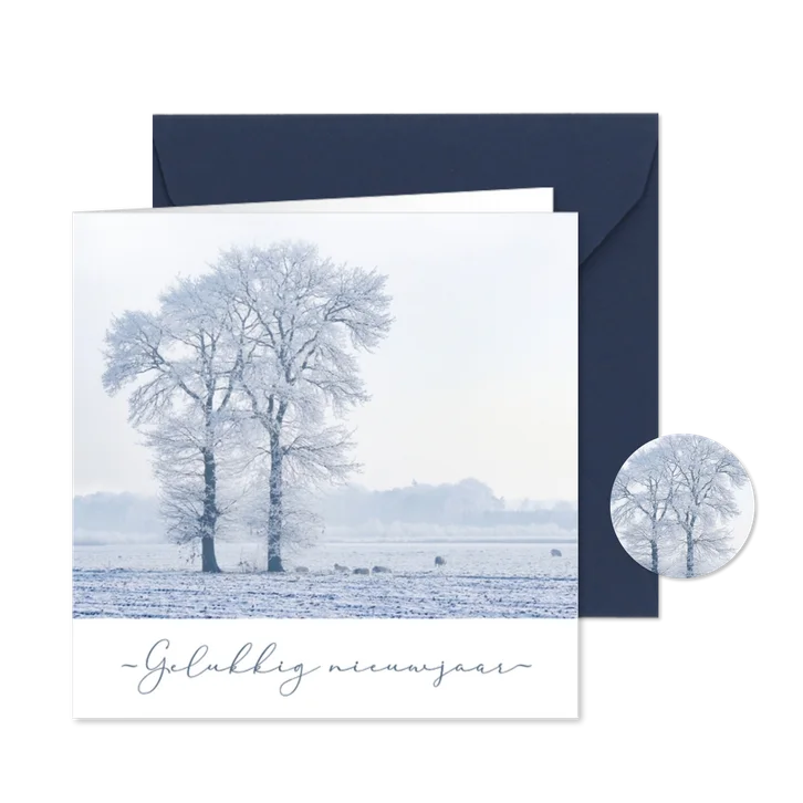 Nieuwjaarskaart sneeuwlandschap bomen