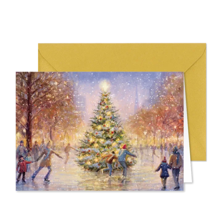 Schaatsende mensen op het ijs rondom de kerstboom