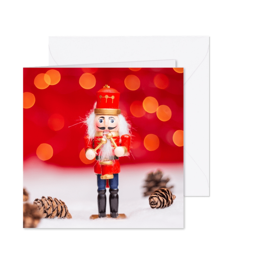 Kerstkaart met een notenkraker op sneeuw - Kaartimpressie