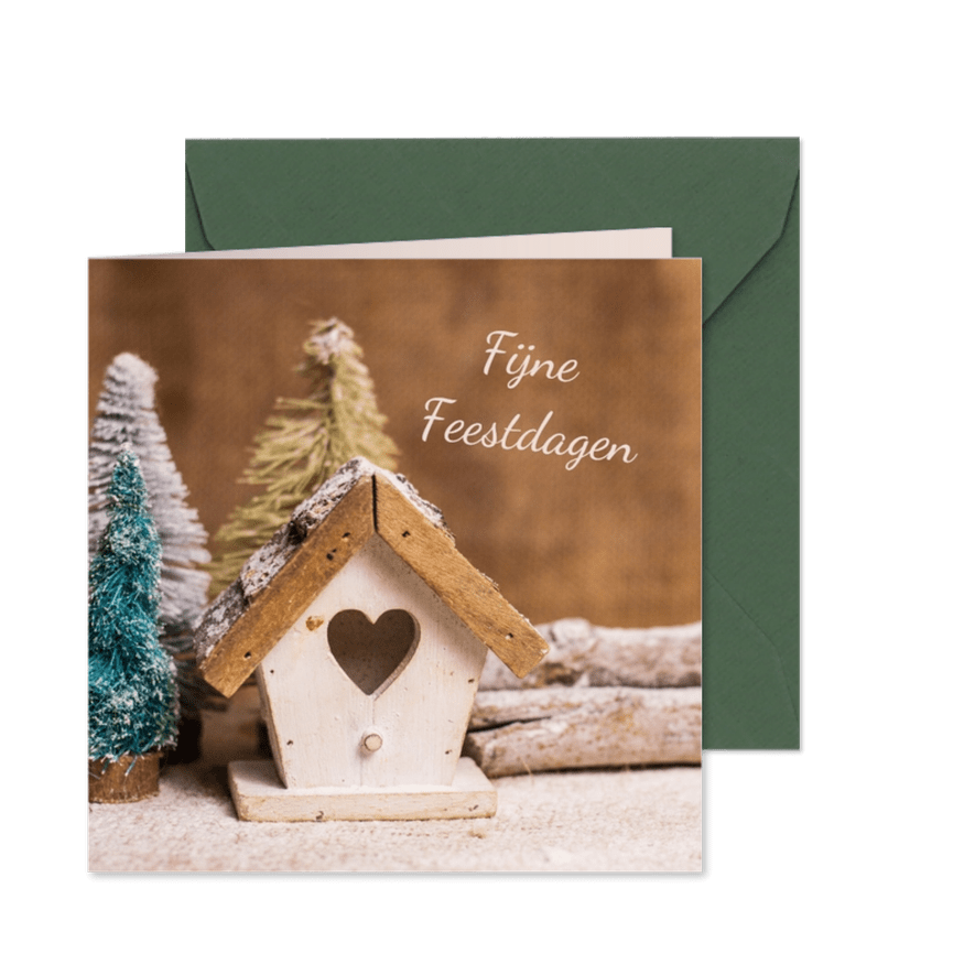 Kerstkaart met houten huisje in een winterlandschap - Kaartimpressie