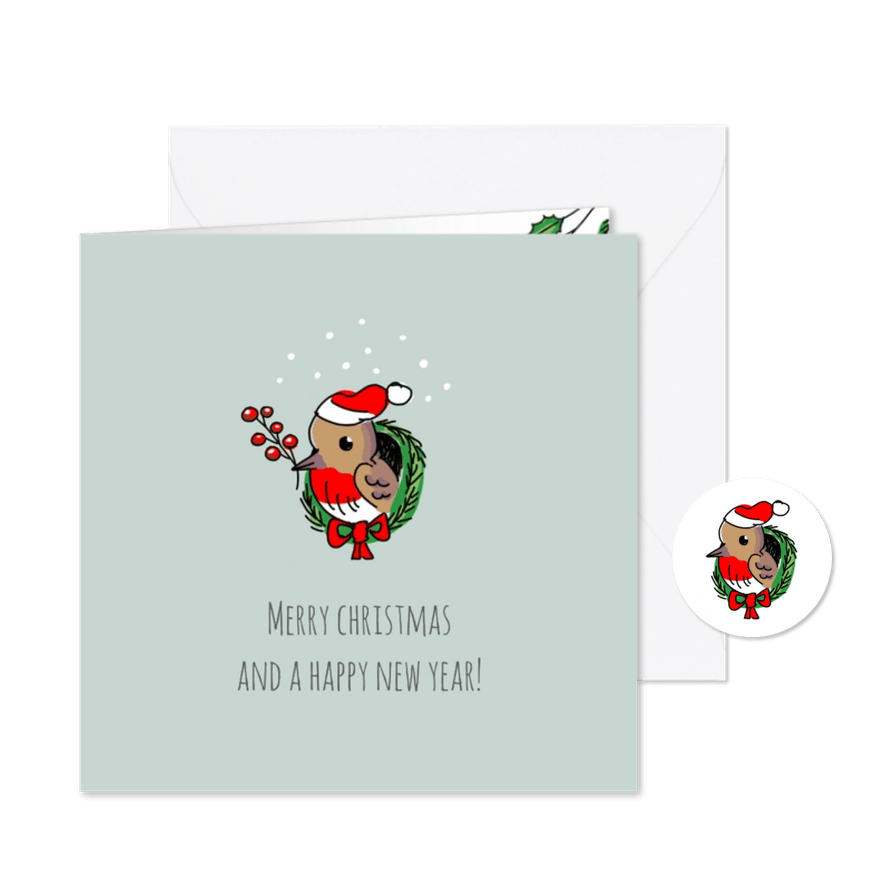 Kerstkaart roodborstje met kerstmuts in kerstkrans - Kaartimpressie