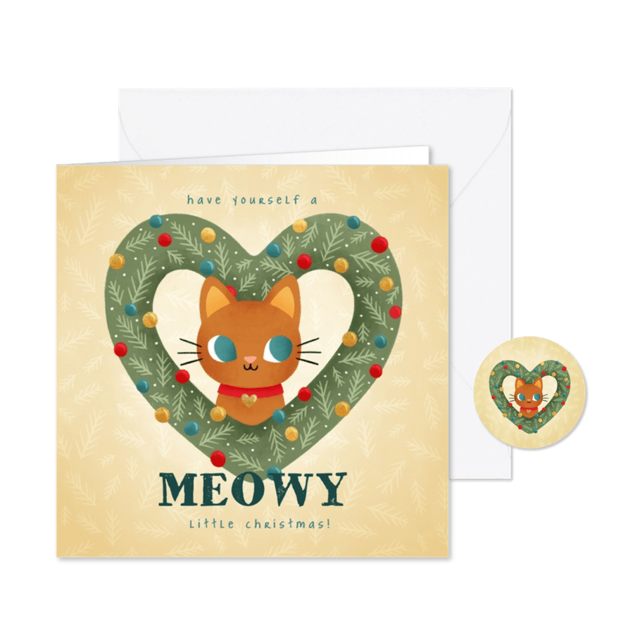 Lieve kerstkaart met kat in hartvormige krans en kerstballen - Kaartimpressie