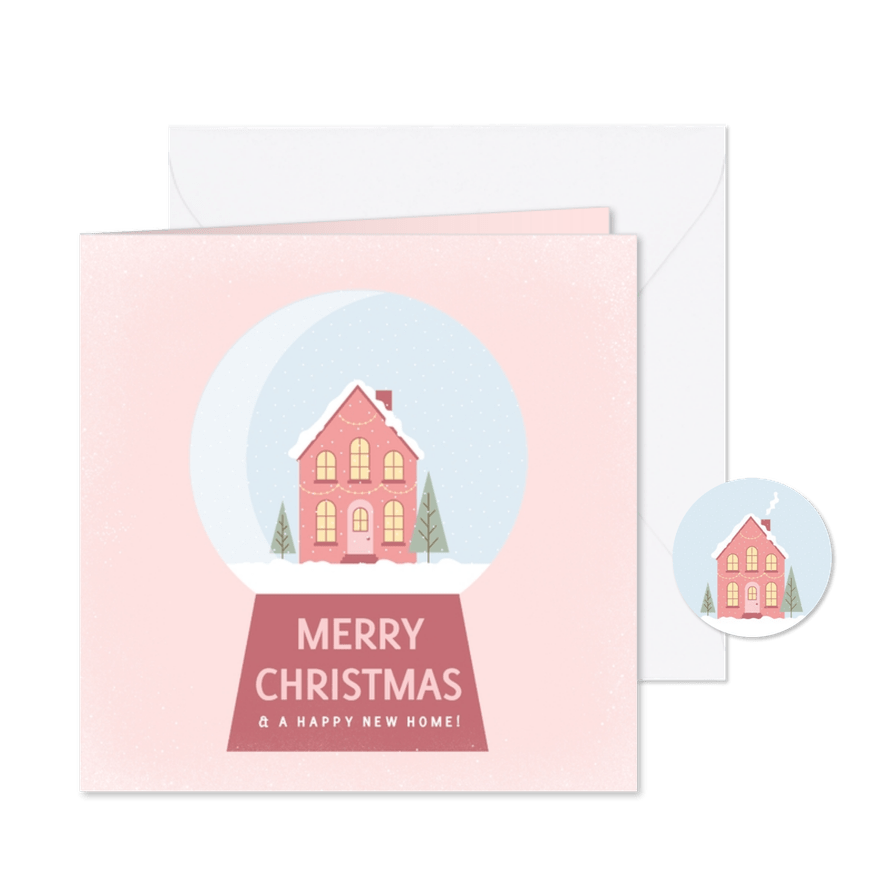 Roze kerst verhuiskaart met een huisje in een sneeuwbol - Kaartimpressie