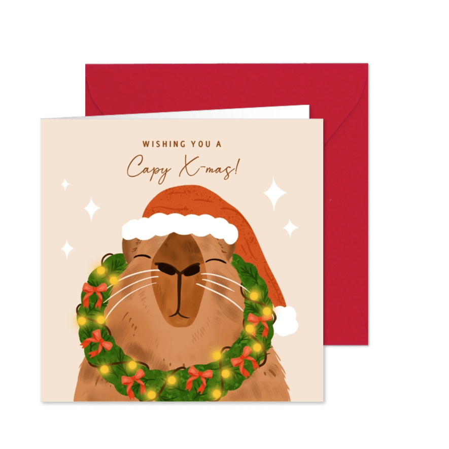 Vrolijke kerstkaart met capybara en kerstkrans - Kaartimpressie