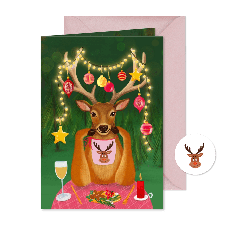 Vrolijke kerstkaart met rendier aan tafel - Kaartimpressie